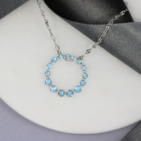 Pre Owned 9ct White Gold Blue Topaz Circle Pendant on a White Gold Chain