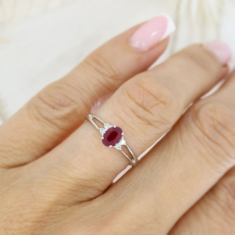 Pre Owned 18ct White Gold Oval Claw Set Ruby and Round Diamond Ring