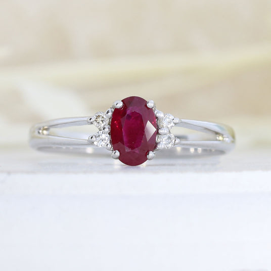 Pre Owned 18ct White Gold Oval Claw Set Ruby and Round Diamond Ring