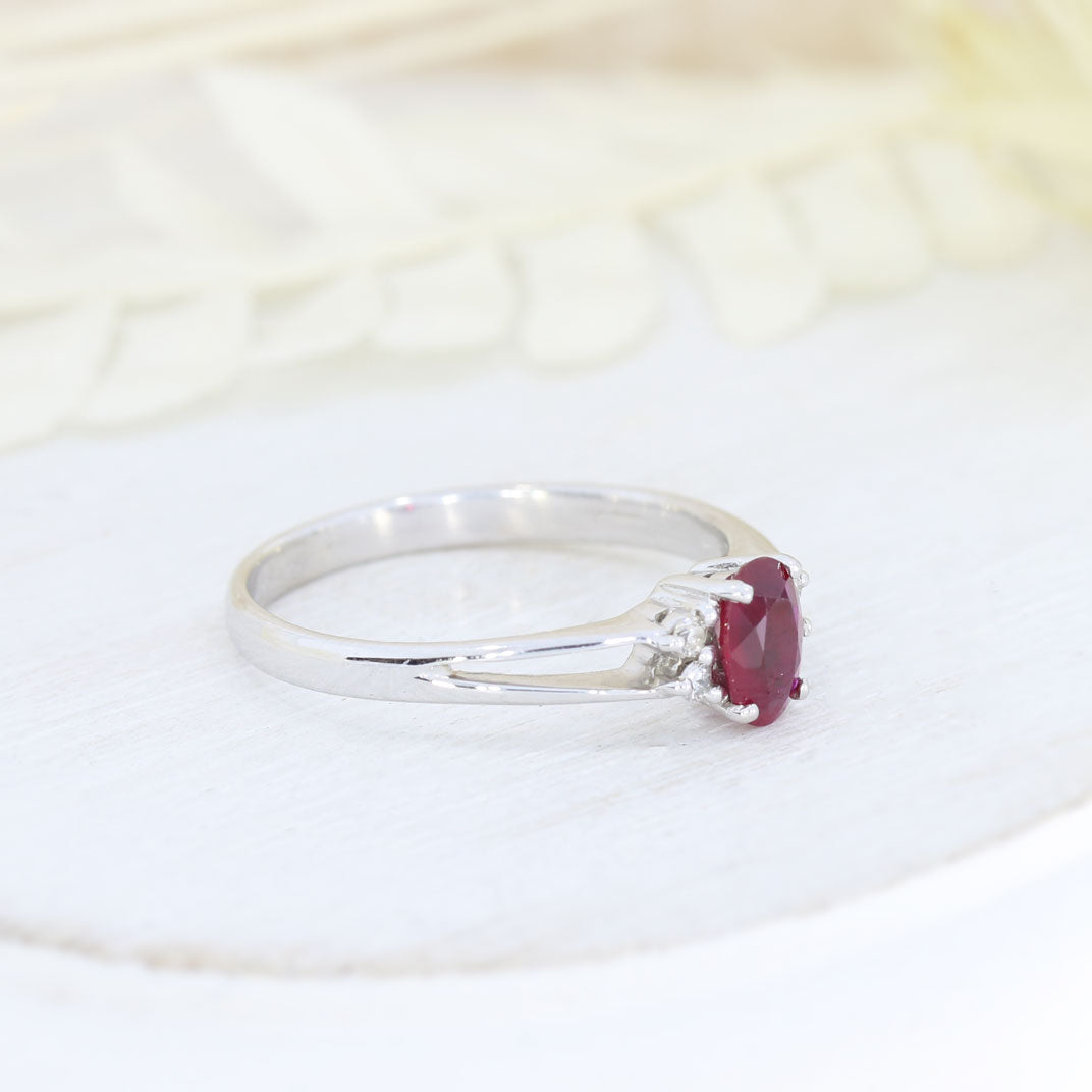 Pre Owned 18ct White Gold Oval Claw Set Ruby and Round Diamond Ring