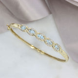 Pre Owned 9ct Yellow Gold Hinged Bangle with Blue Topaz & Diamonds