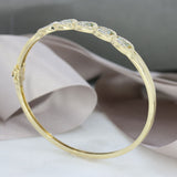 Pre Owned 9ct Yellow Gold Hinged Bangle with Blue Topaz & Diamonds