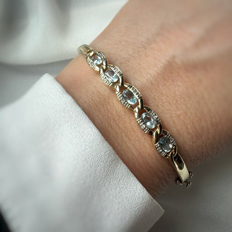 Pre Owned 9ct Yellow Gold Hinged Bangle with Blue Topaz & Diamonds