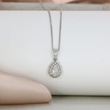 18ct White Gold Pear Shaped Diamond Halo Pendant on an 18ct 18inch White Gold Chain