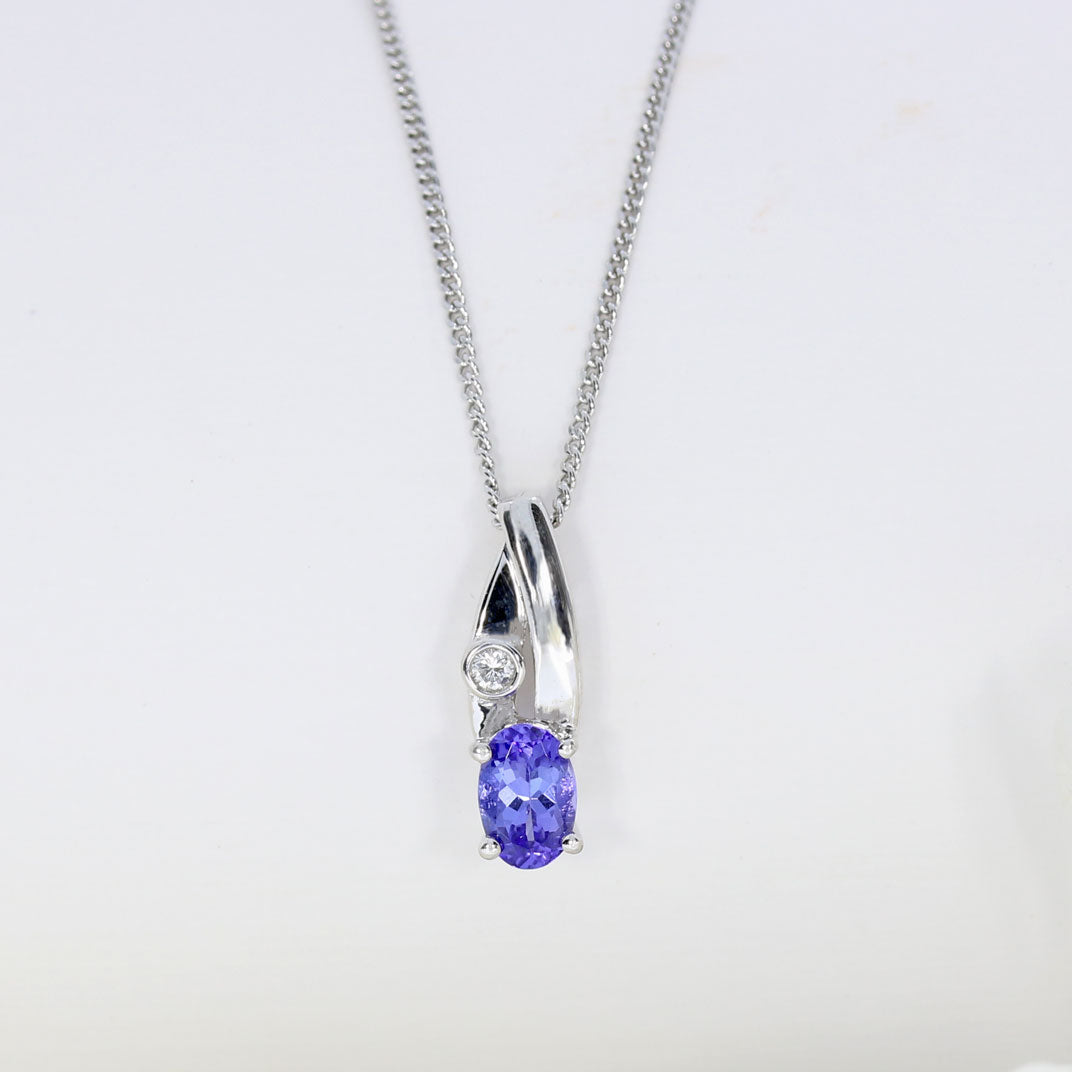 18ct Gold Tanzanite & Diamond Pendent on a 9ct 18inch Chain