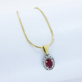 18ct White & Yellow Gold Oval Ruby and Diamond Halo Pendant on an 18ct Chain