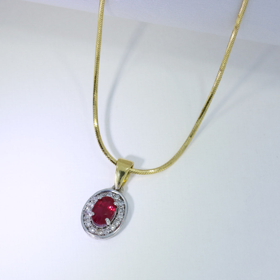 18ct White & Yellow Gold Oval Ruby and Diamond Halo Pendant on an 18ct Chain