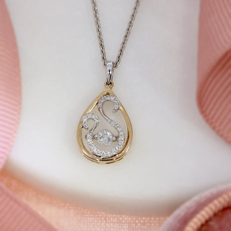 18ct Rose and White Gold Teardrop Pendant With Fancy Diamond Swirl Detail