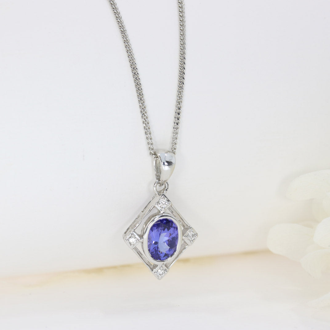 9ct White Gold Tanzanite & Diamond Pendant on a 9ct 16Inch Chain
