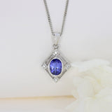 9ct White Gold Tanzanite & Diamond Pendant on a 9ct 16Inch Chain
