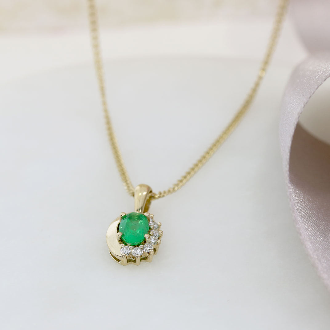 9ct Yellow Gold Oval Emerald Pendant With Claw Set Diamonds on a 9ct 18" Chain