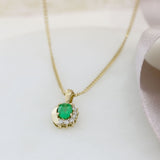 9ct Yellow Gold Oval Emerald Pendant With Claw Set Diamonds on a 9ct 18" Chain