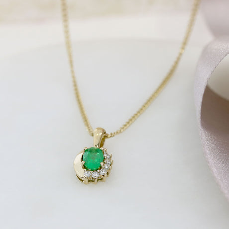 9ct Yellow Gold Oval Emerald Pendant With Claw Set Diamonds on a 9ct 18" Chain