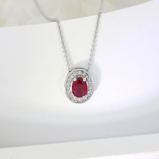 18ct White Gold Oval Ruby and Diamond Halo Pendant on an 18ct 18" Anchor Chain