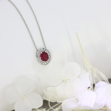 18ct White Gold Oval Ruby and Diamond Halo Pendant on an 18ct 18" Anchor Chain