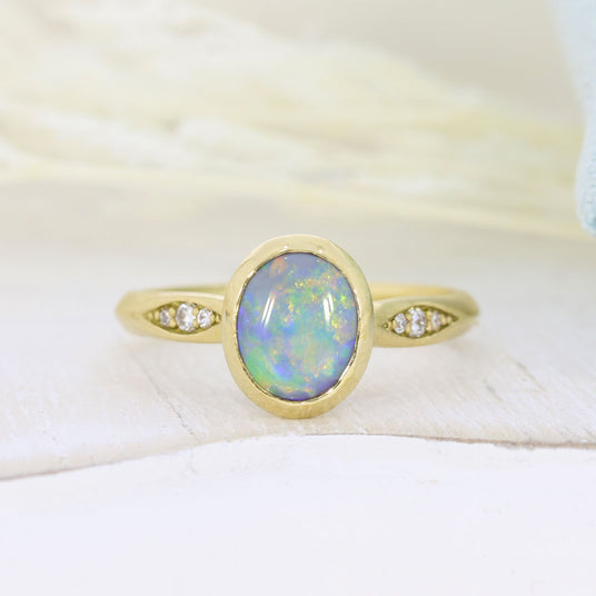18ct Yellow Gold Oval Rubover Set Opal Dress Ring with Pave Set Diamond Shoulders