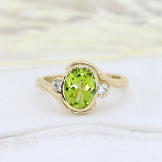 9ct Yellow Gold Oval Rubover Set Peridot & Round Diamond Dress Ring