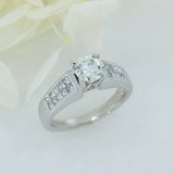Pre Owned 18ct Brilliant Cut Diamond Solitaire Ring with Princess Cut Diamond Shoulders Total 1.30ct