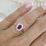 18ct Rose gold rub over set oval ruby and claw set diamond cluster ring