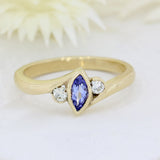 9ct yellow gold tanzanite ring with a diamond either side diamond 0.13ct