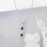 9ct White Gold Ruby and Diamond 3 Stone Pendant On a 18inch 9ct Chain