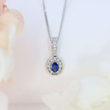 18ct White Gold Sapphire and Diamond Oval Cluster Pendant On a 18ct 18" Chain