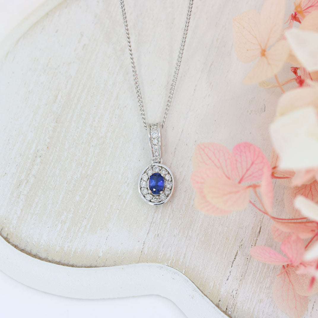 18ct White Gold Sapphire and Diamond Oval Cluster Pendant On a 18ct 18" Chain