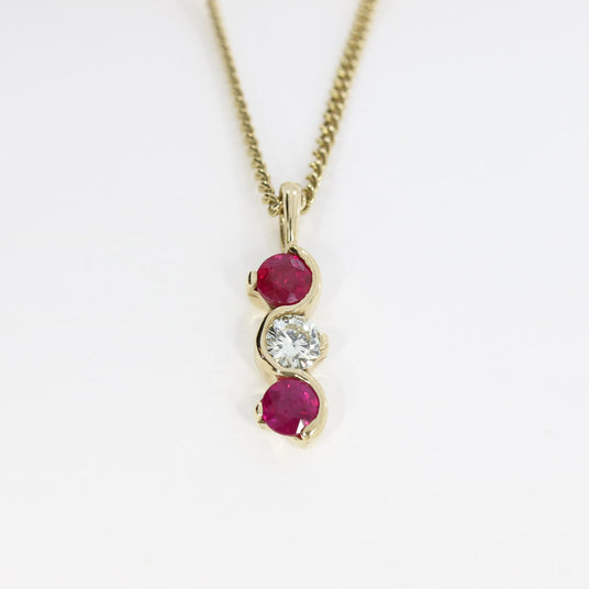 9ct Yellow Gold Ruby and Diamond Wave Style 3 Stone Pendant on a 9ct Yellow Gold 19" Chain