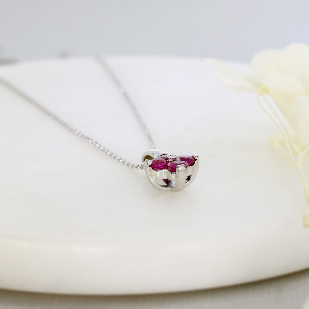 18ct White Gold Claw Set Pendant with Four Round Rubies in a Flower Shape