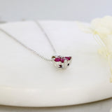 18ct White Gold Claw Set Pendant with Four Round Rubies in a Flower Shape