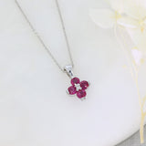 18ct White Gold Claw Set Pendant with Four Round Rubies in a Flower Shape