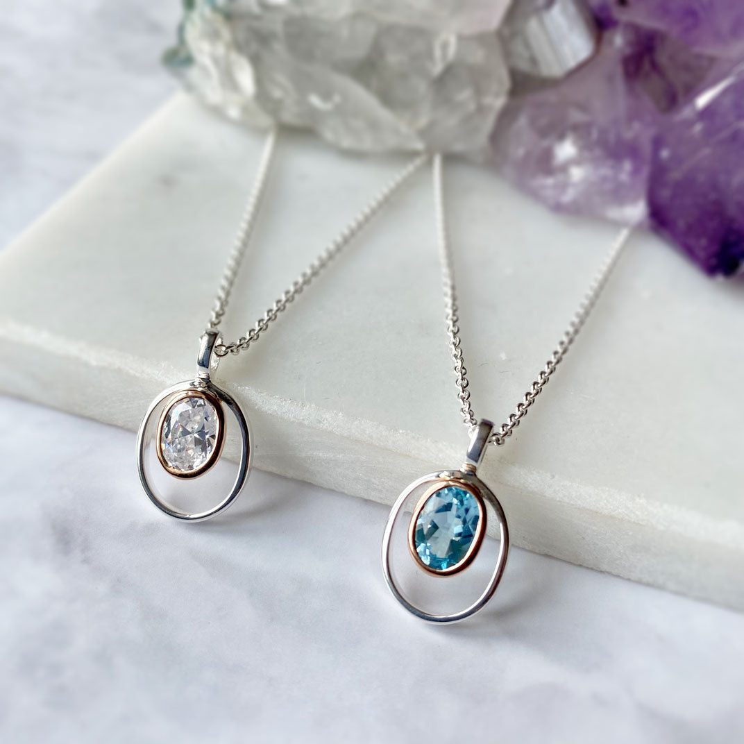 Silver Oval Blue Topaz Pendant with Rose Gold Accent