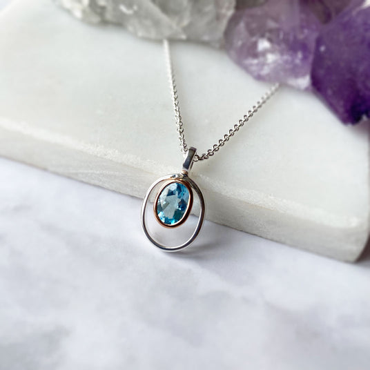 Silver Oval Blue Topaz Pendant with Rose Gold Accent