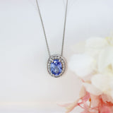 18ct White Gold Oval Claw Set Sapphire & Pave Diamond Halo Pendant on 18ct 18" Chain