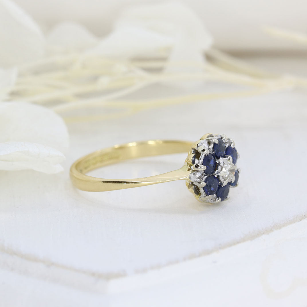 Pre Owned 18ct Yellow Gold Sapphire Cluster Ring with a Diamond Centre