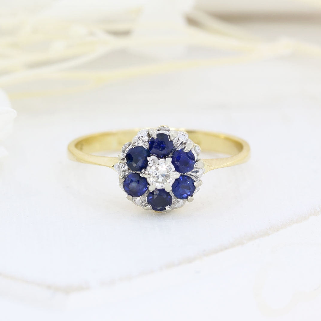 Pre Owned 18ct Yellow Gold Sapphire Cluster Ring with a Diamond Centre