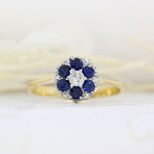 Pre Owned 18ct Yellow Gold Sapphire Cluster Ring with a Diamond Centre