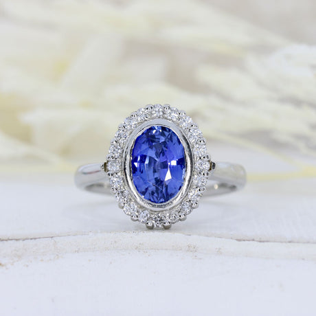 Pre Owned Platinum Oval Tanzanite & Diamond Cluster Ring
