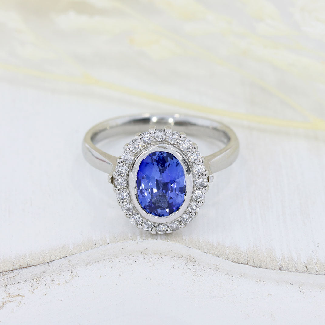 Pre Owned Platinum Oval Tanzanite & Diamond Cluster Ring