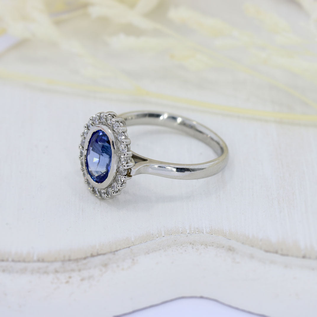 Pre Owned Platinum Oval Tanzanite & Diamond Cluster Ring