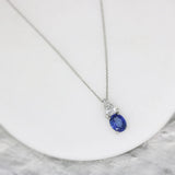 Platinum Oval Sapphire and Trillion Cut Diamond Pendant & Platinum Chain