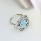 Aquamarine Dress Ring with Pave Set Diamond Halo Surround & Baguette Diamond Shoulders
