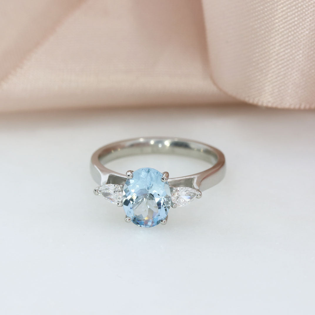 Platinum Oval Aquamarine & Pear Shaped Lab Grown Diamond 3 Stone Ring