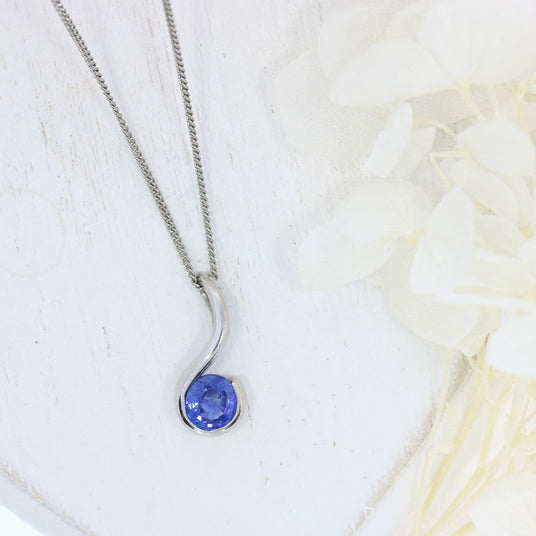 Platinum Rubover Set Round Sapphire Hook Shape Pendant on Platinum 18" Chain