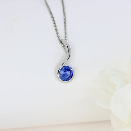 Platinum Rubover Set Round Sapphire Hook Shape Pendant on Platinum 18" Chain