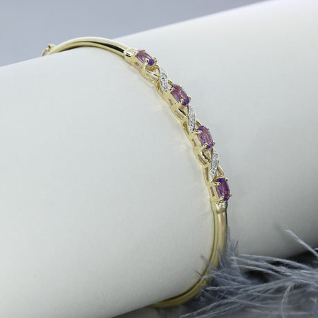 Pre Owned 9ct Gold Bangle with 4 Claw Set Oval Amethysts & Pave Set Diamond Detail