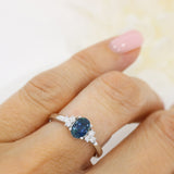 Pre Owned 18ct White Gold Oval Sapphire Ring with Diamond Cluster Shoulders