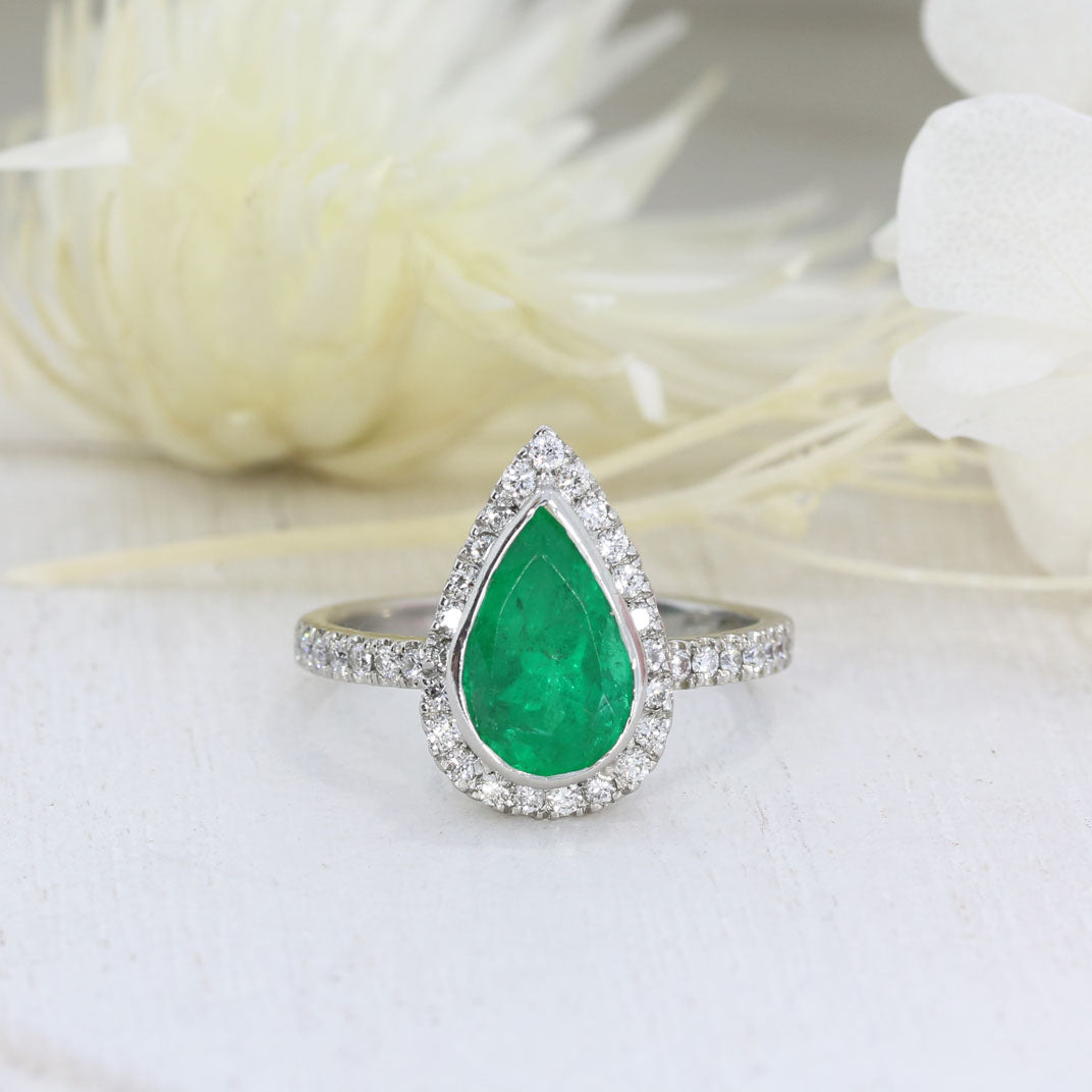 Pre Owned Platinum Pear Shape Emerald & Diamond Halo