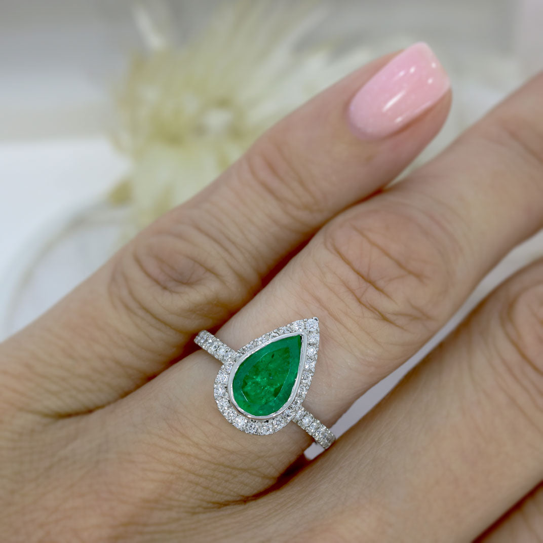 Pre Owned Platinum Pear Shape Emerald & Diamond Halo