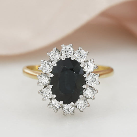 Pre Owned 18ct Yellow Gold Claw Set Oval Sapphire & Round Diamond Cluster Ring